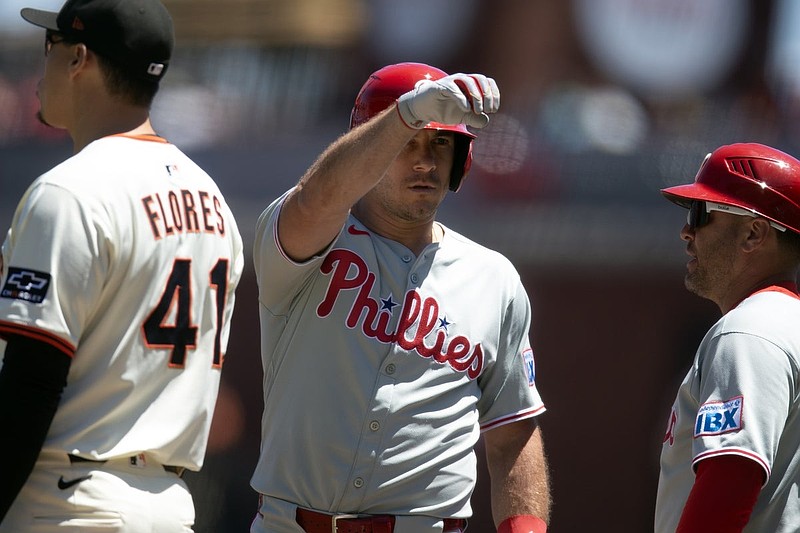 Jul 9, 2025; San Francisco, California, USA; Philadelphia Phillies catcher J.T. Realmuto (center) celebrates his RBI single against the San Francisco Giants during the second inning at Oracle Park. Mandatory Credit: D. Ross Cameron-Imagn Images