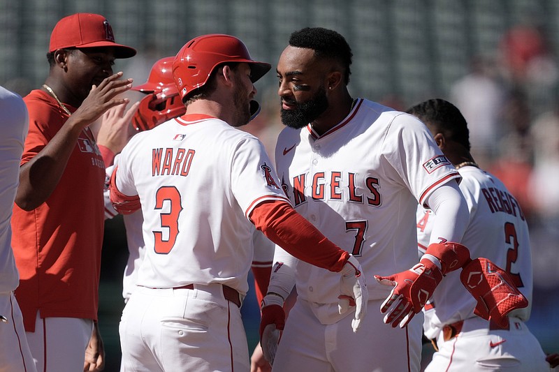 Apr 20, 2025; Anaheim, California, USA; Los Angeles Angels center fielder Jo Adell (7) celebrates with left fielder Taylor Ward (3) after hitting a walk-off double against the San Francisco Giants at Angel Stadium. Mandatory Credit: Kirby Lee-Imagn Images