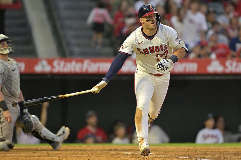 Jul 12, 2025; Anaheim, California, USA;  Los Angeles Angels right fielder Mike Trout (27) watches the flight of the ball on his two-run home run during the fifth inning against the Arizona Diamondbacks at Angel Stadium. Mandatory Credit: Jayne Kamin-Oncea-Imagn Images