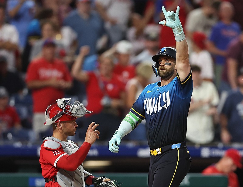 Jul 18, 2025; Philadelphia, Pennsylvania, USA; Philadelphia Phillies first base Bryce Harper (3) reacts in front of Los Angeles Angels catcher Logan O'Hoppe (14) after hitting his second home run of the game during the eighth inning at Citizens Bank Park. Mandatory Credit: Bill Streicher-Imagn Images
