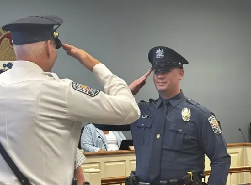 New Upper Gwynedd police officer Kyle Fizel salutes police chief David Duffy after receiving his oath on Monday, July 14, 2025. (Photo courtesy of Upper Gwynedd Police Department)