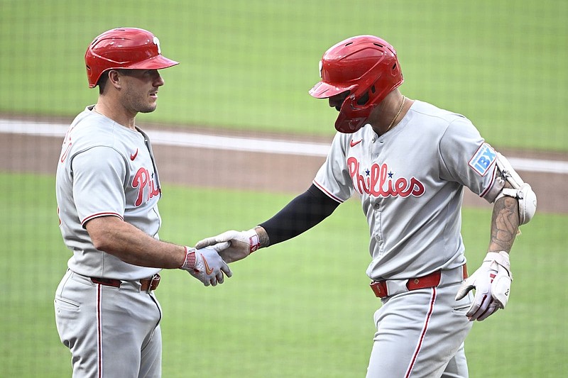 Jul 11, 2025; San Diego, California, USA; Philadelphia Phillies right fielder Nick Castellanos (8) is congratulated by J.T. Realmuto (10) after hitting a solo home run during the second inning against the San Diego Padres at Petco Park. Mandatory Credit: Denis Poroy-Imagn Images