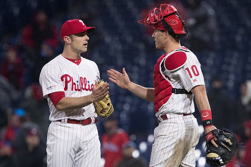 Apr 5, 2019; Philadelphia, PA, USA; Philadelphia Phillies relief pitcher David Robertson (30) and catcher J.T. Realmuto (10) celebrate a victory against the Minnesota Twins at Citizens Bank Park. Mandatory Credit: Bill Streicher-USA TODAY Sports