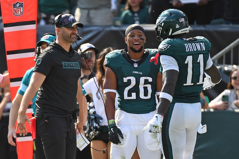 Oct 13, 2024; Philadelphia, Pennsylvania, USA; Philadelphia Eagles head coach Nick Sirianni and running back Saquon Barkley (26) celebrate touchdown catch by wide receiver A.J. Brown (11) against the Cleveland Browns during the second quarter at Lincoln Financial Field. Mandatory Credit: Eric Hartline-Imagn Images
