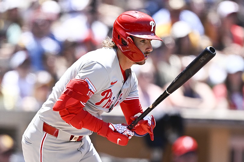 Jul 13, 2025; San Diego, California, USA; Philadelphia Phillies second baseman Bryson Stott (5) hits a single during the fourth inning against the San Diego Padres at Petco Park. Mandatory Credit: Denis Poroy-Imagn Images