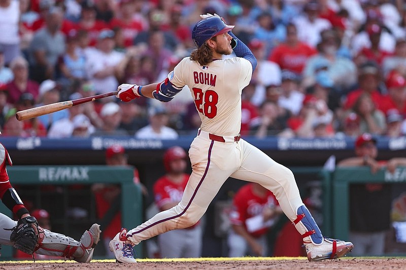 Jul 5, 2025; Philadelphia, Pennsylvania, USA; Philadelphia Phillies third base Alec Bohm (28) hits a two RBI home run during the sixth inning against the Cincinnati Reds at Citizens Bank Park. Mandatory Credit: Bill Streicher-Imagn Images