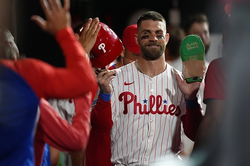Jul 23, 2025; Philadelphia, Pennsylvania, USA; Philadelphia Phillies infielder Bryce Harper (3) celebrates with teammates after scoring a run against the Boston Red Sox in the eleventh inning at Citizens Bank Park. Mandatory Credit: Kyle Ross-Imagn Images
