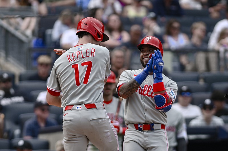 Jul 26, 2025; Bronx, New York, USA; Philadelphia Phillies second baseman Edmundo Sosa (33) celebrates with outfielder Max Kepler (17) after hitting a two run home run against the New York Yankees during the seventh inning at Yankee Stadium. Mandatory Credit: John Jones-Imagn Images