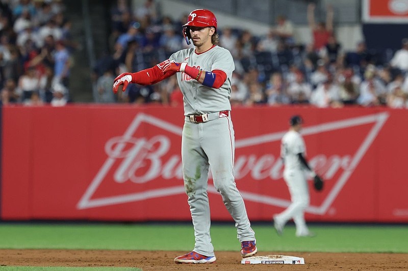 Jul 25, 2025; Bronx, New York, USA; Philadelphia Phillies second baseman Bryson Stott (5) reacts after hitting a two-run double during the ninth inning against the New York Yankees at Yankee Stadium. Mandatory Credit: Vincent Carchietta-Imagn Images
