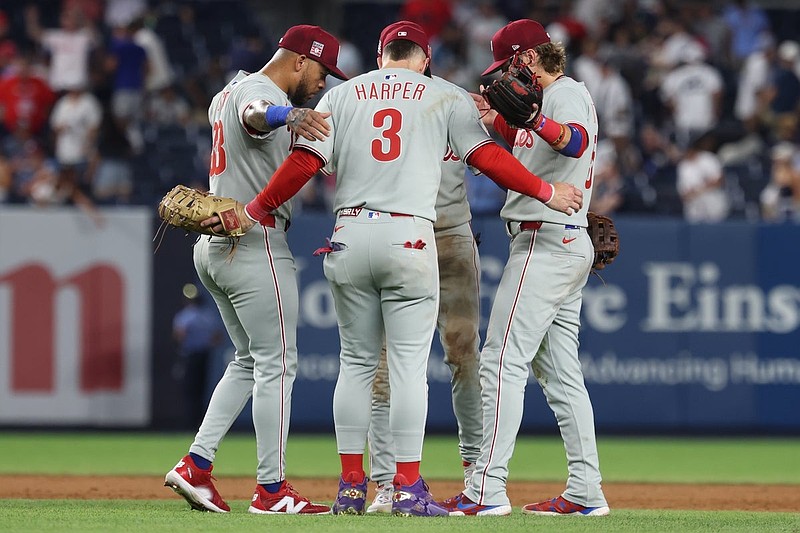 Jul 25, 2025; Bronx, New York, USA; Philadelphia Phillies first baseman Bryce Harper (3) celebrates with teammates after the game against the New York Yankees at Yankee Stadium. Mandatory Credit: Vincent Carchietta-Imagn Images