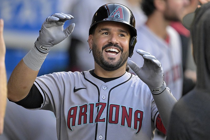 Jul 12, 2025; Anaheim, California, USA;  Arizona Diamondbacks third baseman Eugenio Suarez (28) celebrates in the dugout after his second solo home run of the game during the fourth inning against the Los Angeles Angels at Angel Stadium. Mandatory Credit: Jayne Kamin-Oncea-Imagn Images