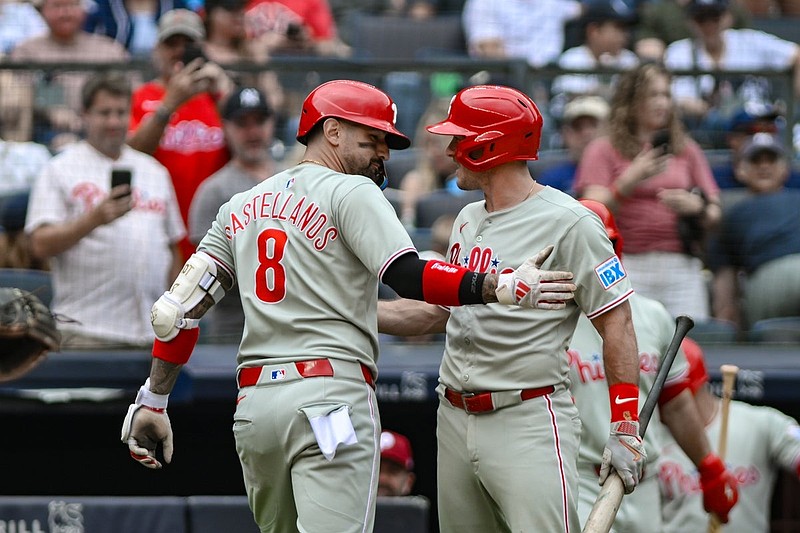 Jul 27, 2025; Bronx, New York, USA; Philadelphia Phillies outfielder Nick Castellanos (8) celebrates with catcher J.T. Realmuto (10) after hitting a solo home run against the New York Yankees during the second inning at Yankee Stadium. Mandatory Credit: John Jones-Imagn Images