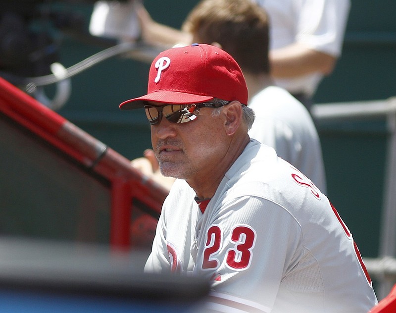 Jun 10, 2015; Cincinnati, OH, USA; Philadelphia Phillies manager Ryne Sandberg watches from the dugout during a game with the Cincinnati Reds at Great American Ball Park. Mandatory Credit: David Kohl-USA TODAY Sports