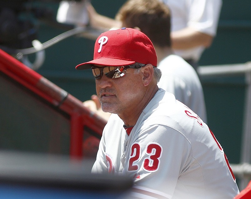 Jun 10, 2015; Cincinnati, OH, USA; Philadelphia Phillies manager Ryne Sandberg watches from the dugout during a game with the Cincinnati Reds at Great American Ball Park. Mandatory Credit: David Kohl-USA TODAY Sports