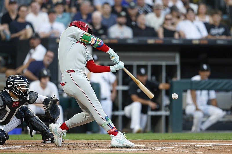 Jul 28, 2025; Chicago, Illinois, USA; Philadelphia Phillies first baseman Bryce Harper (3) hits a two-run double against the Chicago White Sox during the third inning at Rate Field. Mandatory Credit: Kamil Krzaczynski-Imagn Images