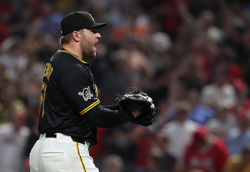 Jul 1, 2025; Pittsburgh, Pennsylvania, USA;  Pittsburgh Pirates relief pitcher David Bednar (51) reacts after the final out against the St. Louis Cardinals at PNC Park. Mandatory Credit: Charles LeClaire-Imagn Images