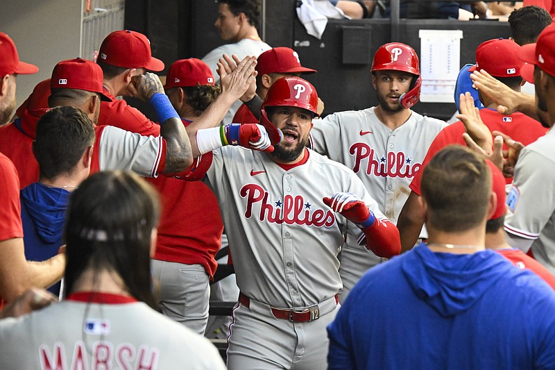 Jul 29, 2025; Chicago, Illinois, USA;  Philadelphia Phillies outfielder Kyle Schwarber (12) celebrates in the dugout after hitting a two-run home run during the third inning against the Chicago White Sox at Rate Field. Mandatory Credit: Matt Marton-Imagn Images