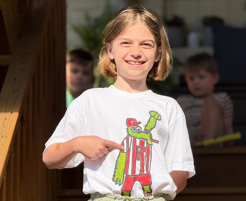 Devin Cassidy, 10, poses with the Phillie Phanatic shirt she designed to "help sick kids in Philadelphia." (Credit: Ryan Cassidy)