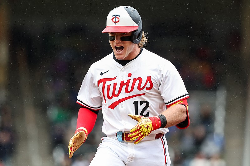 May 21, 2025; Minneapolis, Minnesota, USA; Minnesota Twins center fielder Harrison Bader (12) celebrates his RBI single against the Cleveland Guardians in the eighth inning during game one of a doubleheader at Target Field. Mandatory Credit: Matt Krohn-Imagn Images