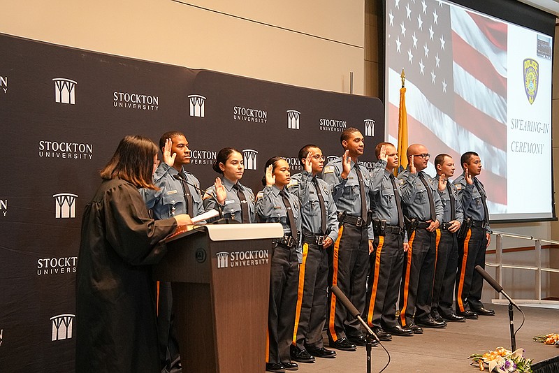 Nine new Stockton University police officers are sworn in by Superior Court Judge Julie E. Nugent on July 29 in the university’s Campus Center Event Room.