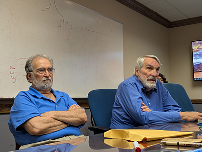 Max Yaffe and Greg Martinchek discussing tariffs in their office last month. Credit: Tom Sofield/LevittownNow.com
