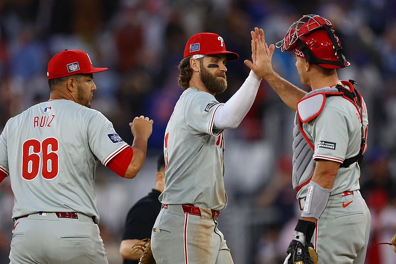 [US, Mexico &amp; Canada customers only] June 8, 2024; London, UNITED KINGDOM;  Philadelphia Phillies players Bryce Harper, Jose Ruiz and J.T. Realmuto celebrate after defeating the New York Mets during a London Series baseball game at Queen Elizabeth Olympic Park. Mandatory Credit: Matthew Childs/Reuters via Imagn Images