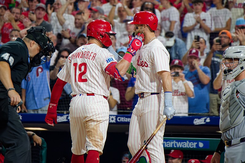 Philadelphia Phillies designated hitter Kyle Schwarber and first baseman Bryce Harper celebrate after Schwarber's home run against the Detroit Tigers at Citizens Bank Park on August 3, 2025. (Grace Del Pizzo/On Pattison)