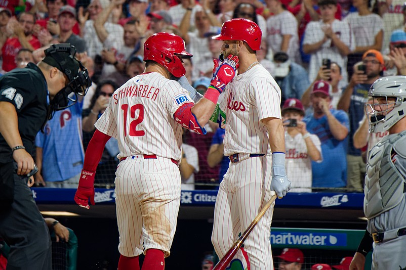 Philadelphia Phillies designated hitter Kyle Schwarber and first baseman Bryce Harper celebrate after Schwarber's home run against the Detroit Tigers at Citizens Bank Park on August 3, 2025. (Grace Del Pizzo/On Pattison)