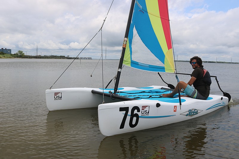 Point Sailing School owner Tyler Myers glides his Hobie Wave catamaran into shore at the Great Egg Harbor Bay in Beesley's Point.