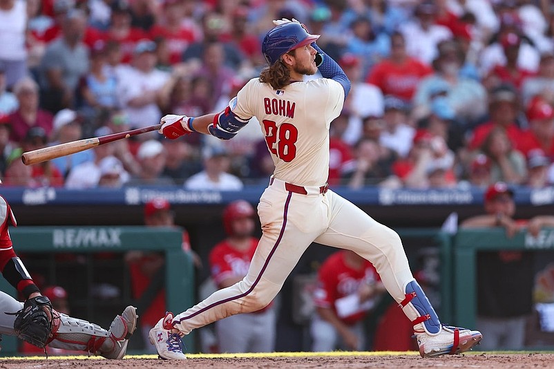 Jul 5, 2025; Philadelphia, Pennsylvania, USA; Philadelphia Phillies third base Alec Bohm (28) hits a two RBI home run during the sixth inning against the Cincinnati Reds at Citizens Bank Park. Mandatory Credit: Bill Streicher-Imagn Images
