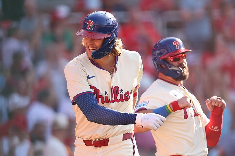 Jul 5, 2025; Philadelphia, Pennsylvania, USA; Philadelphia Phillies third base Alec Bohm (28) celebrates with outfielder Kyle Schwarber (12) after hitting a two RBI home run during the sixth inning against the Cincinnati Reds at Citizens Bank Park. Mandatory Credit: Bill Streicher-Imagn Images