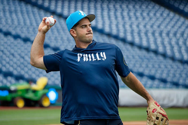Aug 1, 2025; Philadelphia, Pennsylvania, USA; Philadelphia Phillies infielder Otto Kemp tosses a ball during batting practice at Citizens Bank Park. (Grace Del Pizzo/On Pattison)