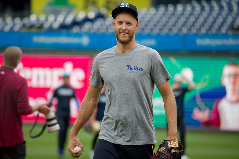 Aug 1, 2025; Philadelphia, Pennsylvania, USA; Philadelphia Phillies pitcher Zack Wheeler smiles as he walks in from the outfield at Citizens Bank Park. (Grace Del Pizzo/On Pattison)