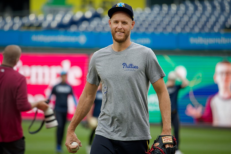 Aug 1, 2025; Philadelphia, Pennsylvania, USA; Philadelphia Phillies pitcher Zack Wheeler smiles as he walks in from the outfield at Citizens Bank Park. (Grace Del Pizzo/On Pattison)