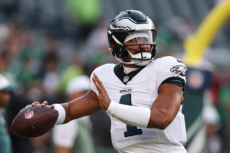 Aug 7, 2025; Philadelphia, Pennsylvania, USA; Philadelphia Eagles quarterback Jalen Hurts (1) throws the ball as he warms up before a game against the Cincinnati Bengals at Lincoln Financial Field. Mandatory Credit: Bill Streicher-Imagn Images