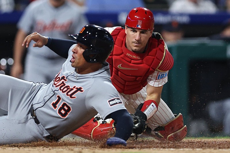 Aug 3, 2025; Philadelphia, Pennsylvania, USA; Philadelphia Phillies catcher J.T. Realmuto (10) tags out Detroit Tigers outfielder Jahmai Jones (18) at home plate during the seventh inning at Citizens Bank Park. Mandatory Credit: Bill Streicher-Imagn Images