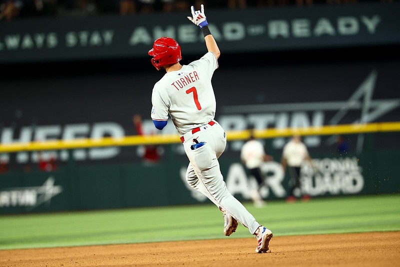 Aug 8, 2025; Arlington, Texas, USA;  Philadelphia Phillies shortstop Trea Turner (7) reacts after hitting a three-run home run during the ninth inning against the Texas Rangers at Globe Life Field. Mandatory Credit: Kevin Jairaj-Imagn Images