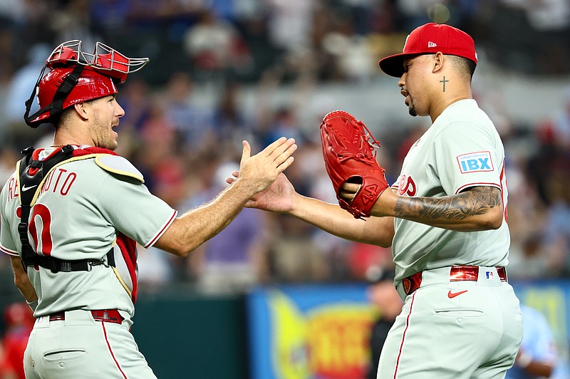 Aug 10, 2025; Arlington, Texas, USA;  Philadelphia Phillies relief pitcher Jhoan Duran (59) celebrates with Philadelphia Phillies catcher J.T. Realmuto (10) after the game against the Texas Rangers at Globe Life Field. Mandatory Credit: Kevin Jairaj-Imagn Images
