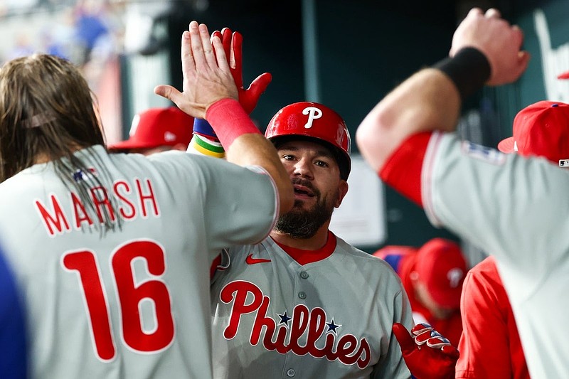 Aug 8, 2025; Arlington, Texas, USA; Philadelphia Phillies designated hitter Kyle Schwarber (12) celebrates with teammates after hitting a home run during the first inning against the Texas Rangers at Globe Life Field. Mandatory Credit: Kevin Jairaj-Imagn Images