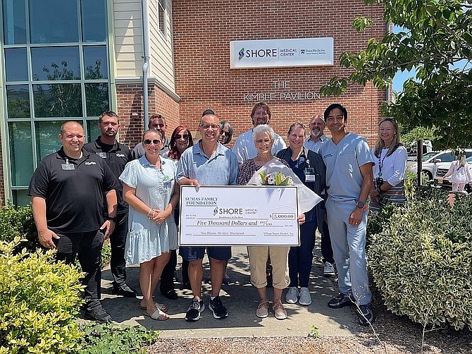 Bob and Patricia Post, holding ceremonial check, are joined by representatives from Village Super Market and Shore Medical Center during a ceremony for the donation. (Photo courtesy of Shore Medical Center)