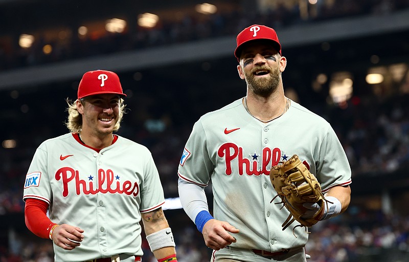 Aug 8, 2025; Arlington, Texas, USA;  Philadelphia Phillies first baseman Bryce Harper (3) laughs with Philadelphia Phillies second baseman Bryson Stott (5) during the game against the Texas Rangers at Globe Life Field. Mandatory Credit: Kevin Jairaj-Imagn Images