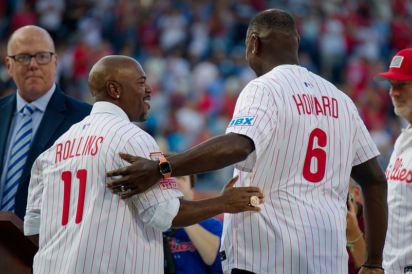 Aug 1, 2025; Philadelphia, Pennsylvania, USA; Former teammates Jimmy Rollins and Ryan Howard embrace during Toyota Phillies Wall of Fame Night at Citizens Bank Park. (Grace Del Pizzo/On Pattison)