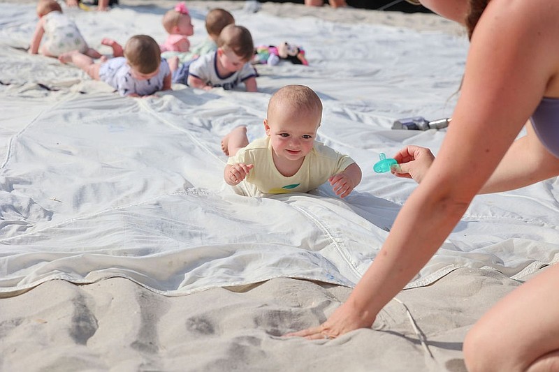The Pamper Scamper features babies crawling off a parachute and into the waiting arms of their parents or guardians. (Photos courtesy of Ocean City)