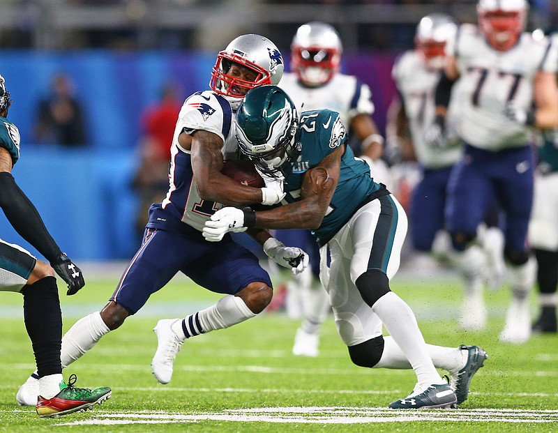Feb 4, 2018; Minneapolis, MN, USA; New England Patriots wide receiver Brandin Cooks (14) is hit and knocked unconscious by Philadelphia Eagles safety Malcolm Jenkins (27) in Super Bowl LII at U.S. Bank Stadium. Mandatory Credit: Mark J. Rebilas-USA TODAY Sports