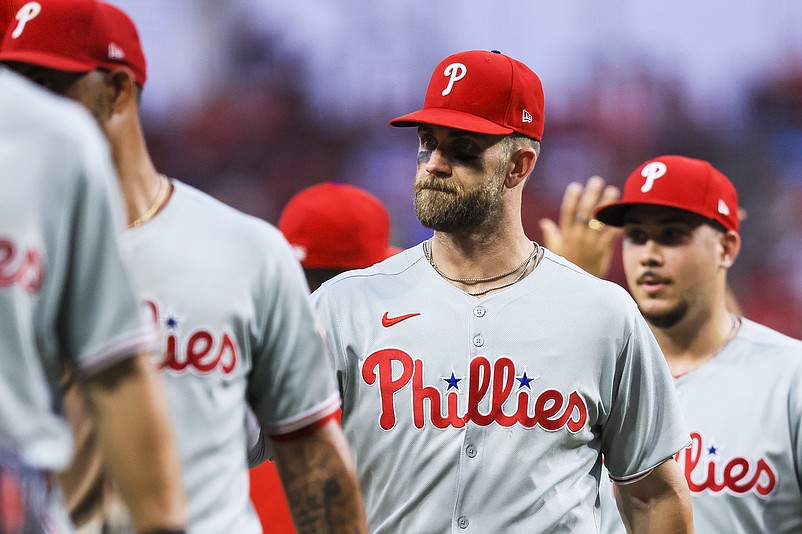 Aug 11, 2025; Cincinnati, Ohio, USA; Philadelphia Phillies first baseman Bryce Harper (3) high fives teammates after the victory over the Cincinnati Reds at Great American Ball Park. Mandatory Credit: Katie Stratman-Imagn Images