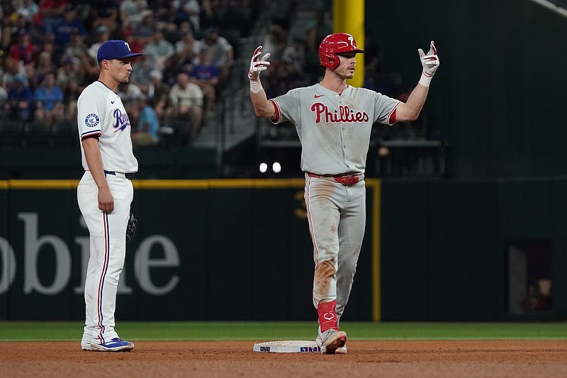 Aug 9, 2025; Arlington, Texas, USA; Philadelphia Phillies outfielder Max Kepler (17) reacts at second base after hitting a two-run double as Texas Rangers shortstop Corey Seager (5) looks on during the seventh inning at Globe Life Field. Mandatory Credit: Raymond Carlin III-Imagn Images