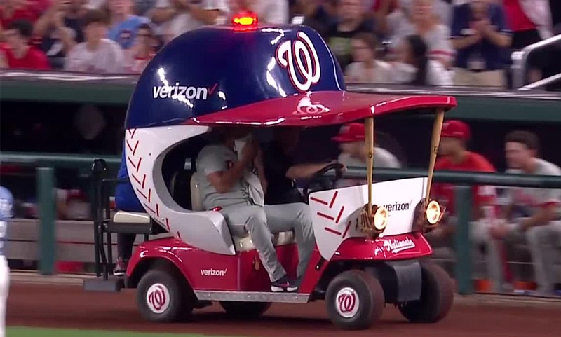 Phillies closer Jhoan Duran is taken off the field on a cart after being hit in the ankle by a line drive. (Credit: @BRWalkoff on X)