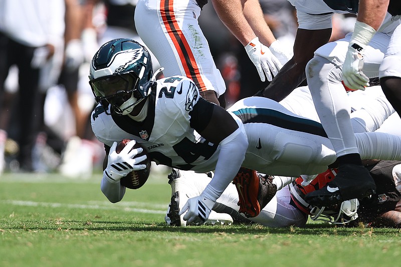 Aug 16, 2025; Philadelphia, Pennsylvania, USA; Philadelphia Eagles safety Andrew Mukuba (24) recovers a fumble against the Cleveland Browns during the second quarter at Lincoln Financial Field. Mandatory Credit: Bill Streicher-Imagn Images