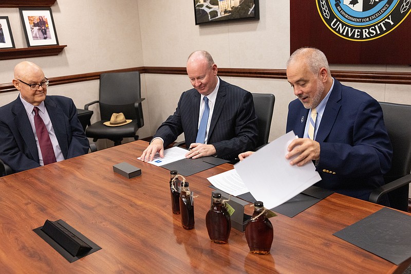 STOCKTON/Gerard O’Sullivan, BCCC President Patrick M. Jones and Stockton President Joe Bertolino sign a transfer agreement between the institutions on Aug. 14.