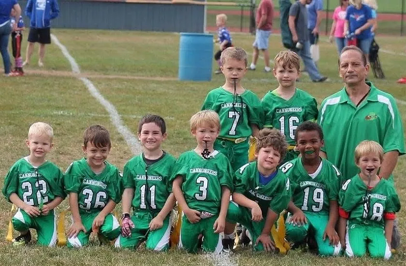 George Adams, right rear, poses with a group of young Lansdale Cannoneers. (Photo via Facebook: Lansdale Cannoneers/The Reporter)
